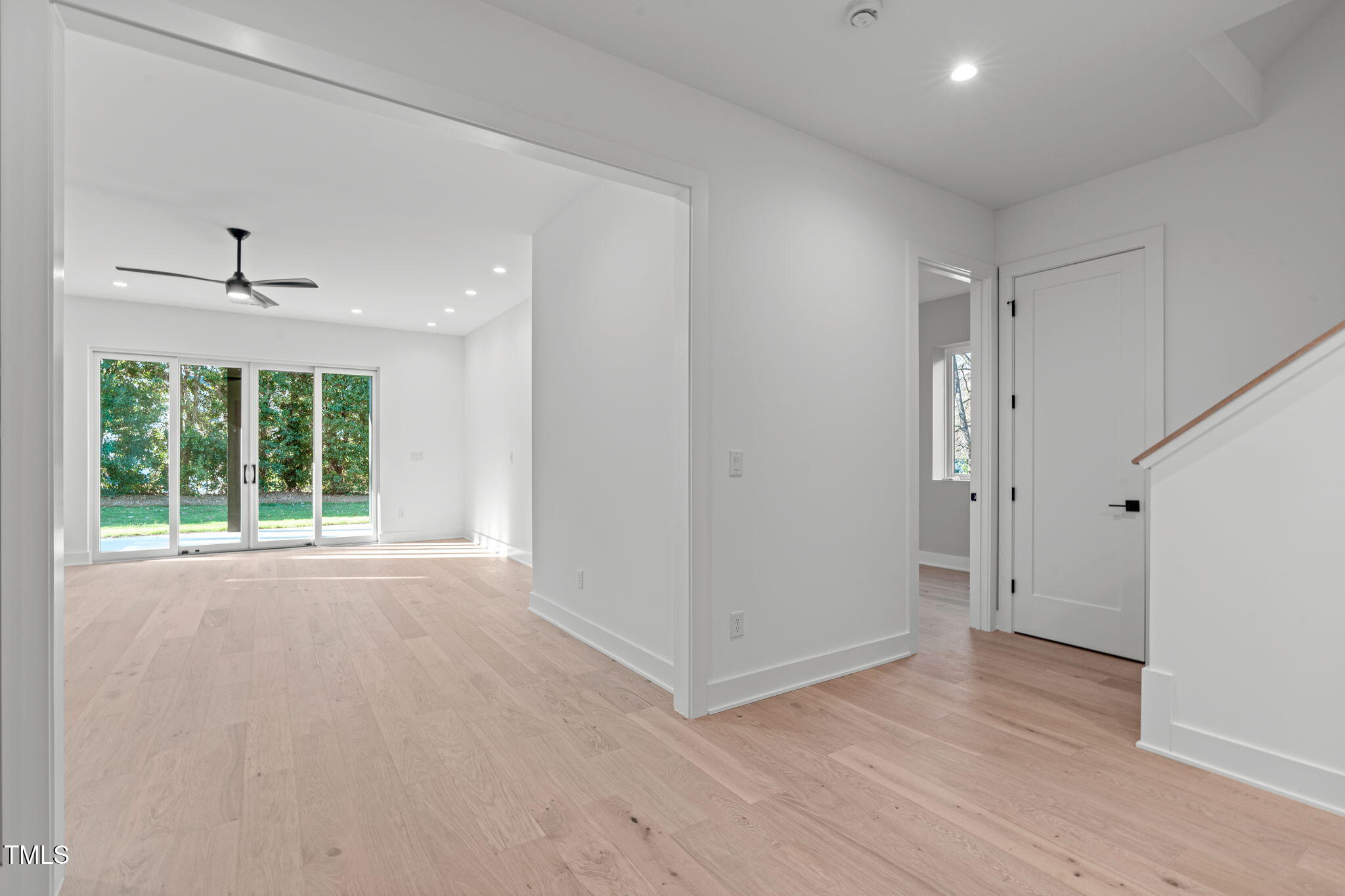 1439 Duplin Road Raleigh, NC 27607 - Photo 50 of 78 a view of an empty room with a window and wooden floor