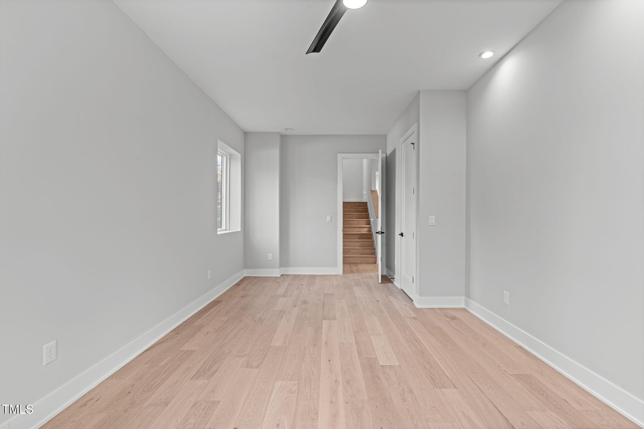 1439 Duplin Road Raleigh, NC 27607 - Photo 52 of 78 a view of empty room with wooden floor and window