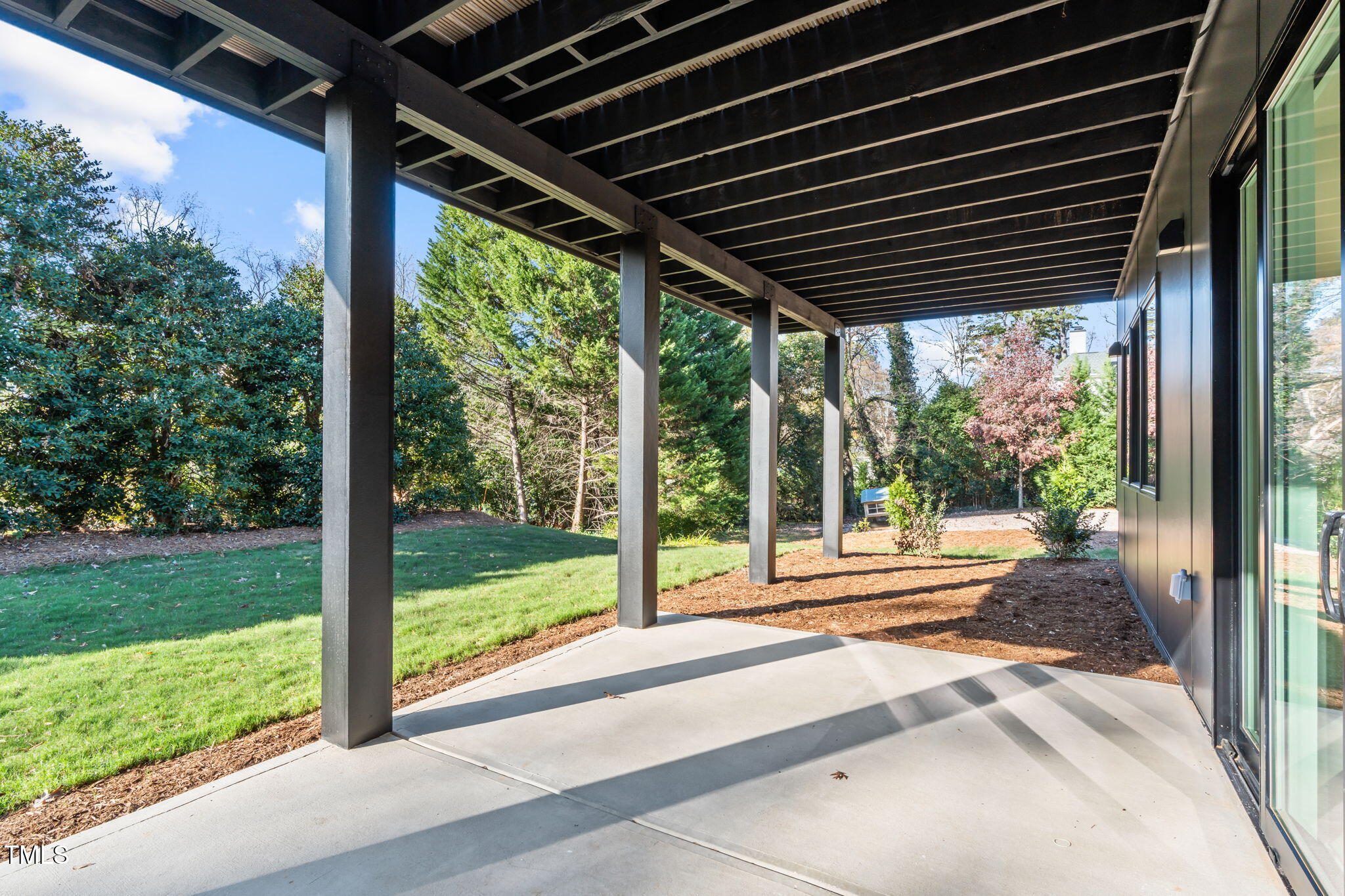 1439 Duplin Road Raleigh, NC 27607 - Photo 55 of 78 a view of a porch with wooden floor next to a yard