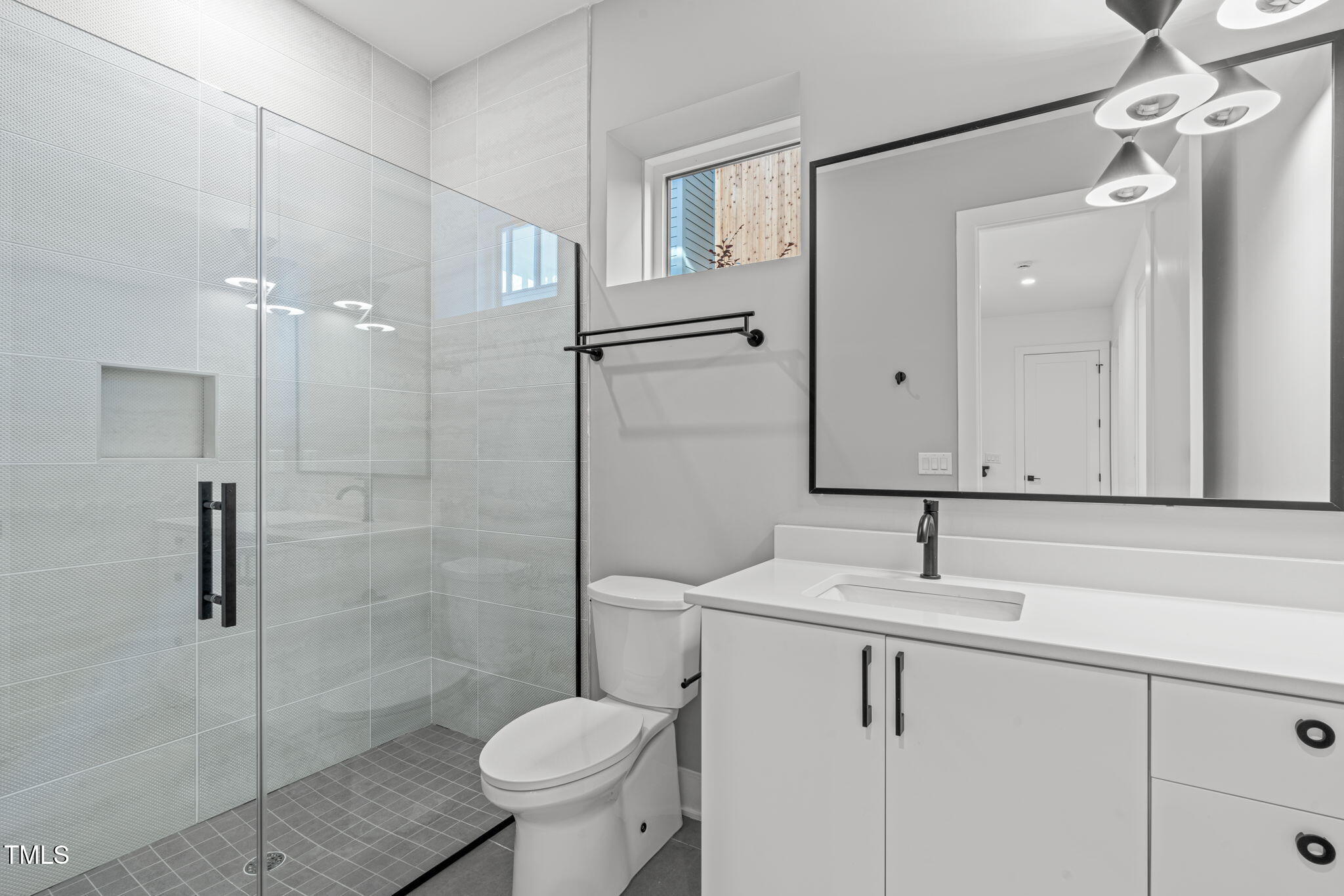 1439 Duplin Road Raleigh, NC 27607 - Photo 58 of 78 a bathroom with a sink toilet and shower