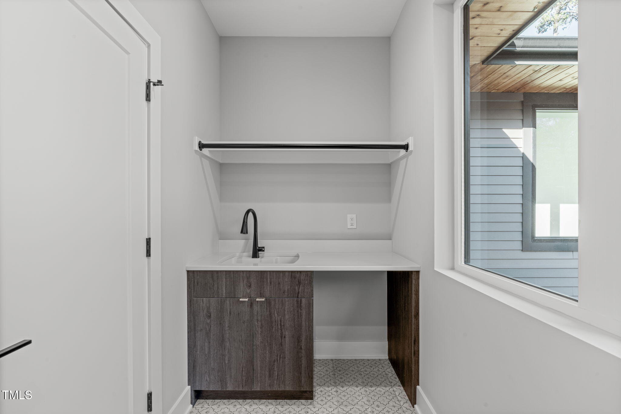 1439 Duplin Road Raleigh, NC 27607 - Photo 60 of 78 a view of walk in closet with window