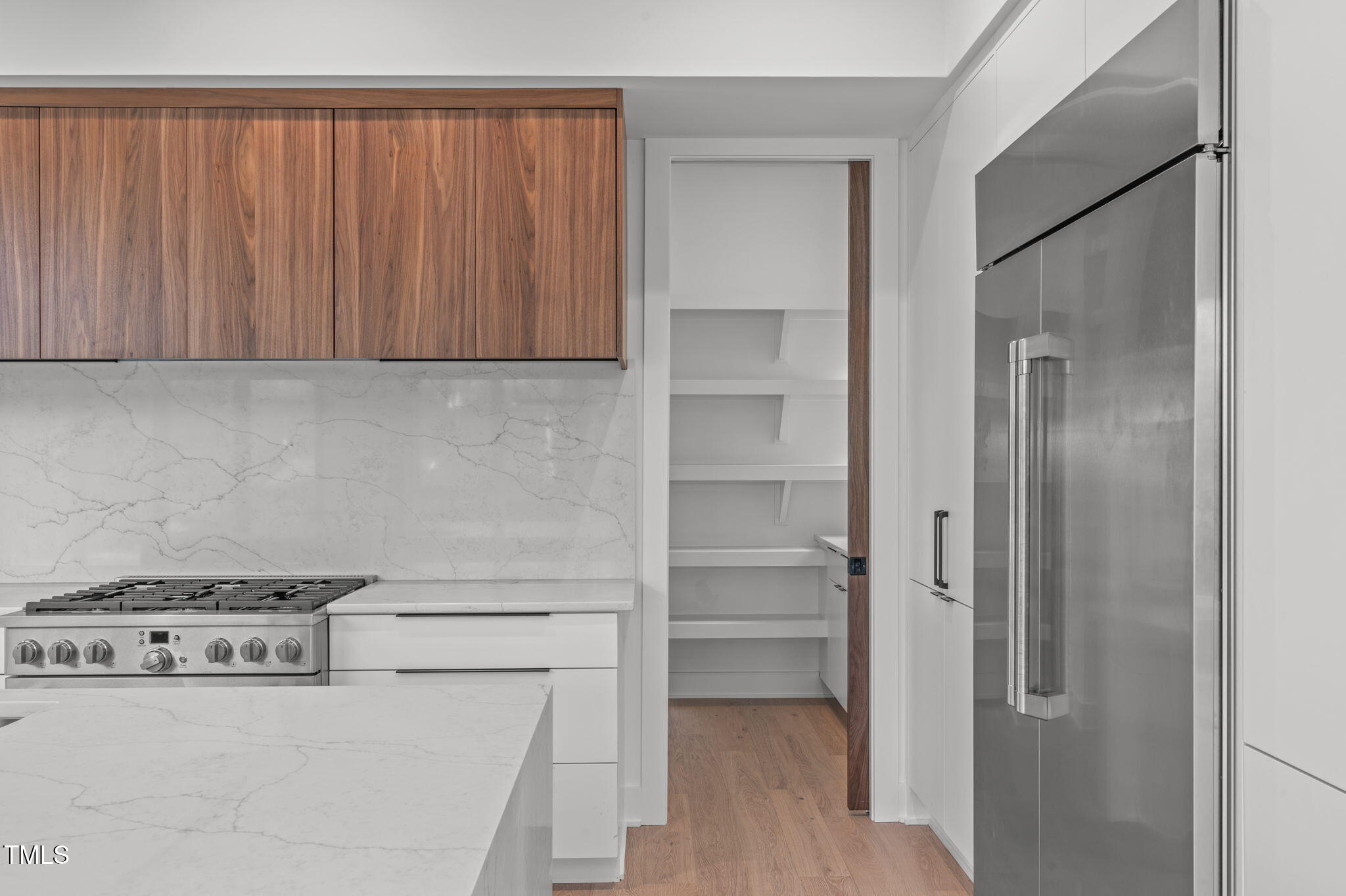 1439 Duplin Road Raleigh, NC 27607 - Photo 8 of 78 a kitchen with a refrigerator and a stove