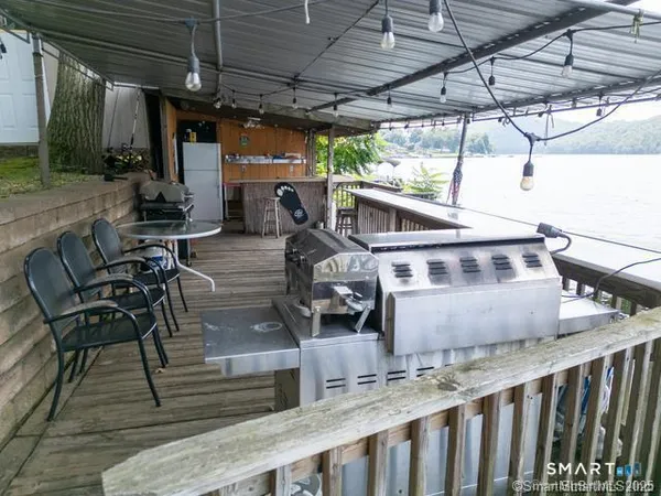 a view of a house with wooden deck