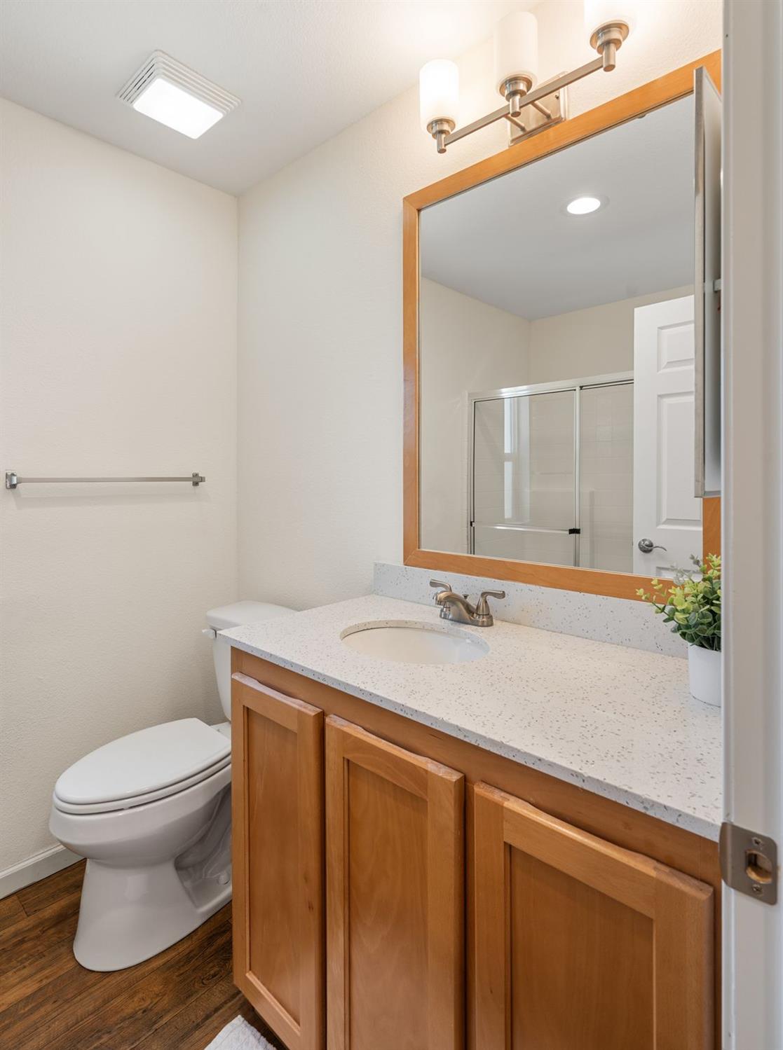 4695 Pacific Street, Unit 9 Rocklin, CA 95667 - Photo 12 of 27 a bathroom with a sink a toilet a mirror and vanity