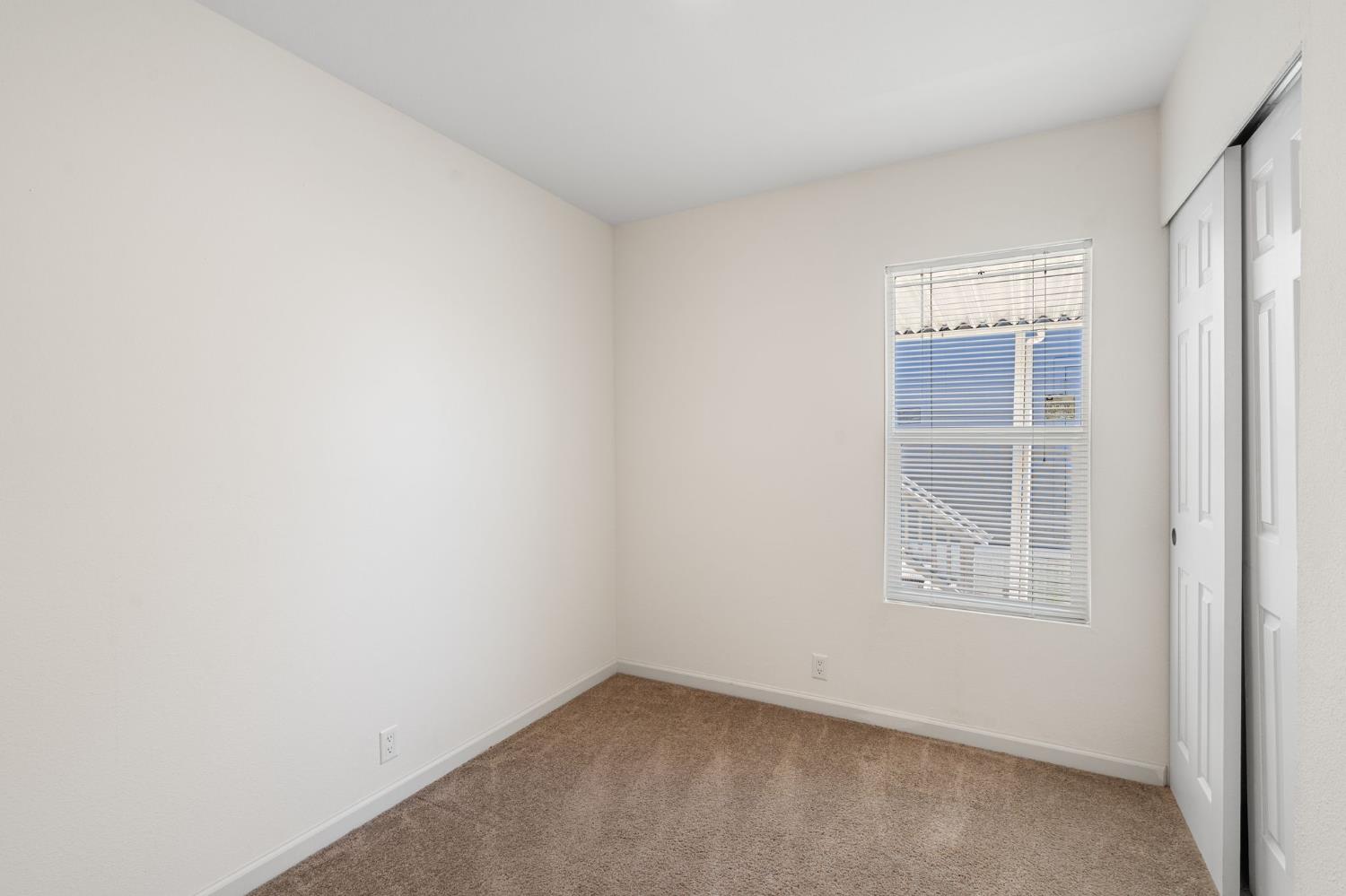 4695 Pacific Street, Unit 9 Rocklin, CA 95667 - Photo 14 of 27 an empty room with windows