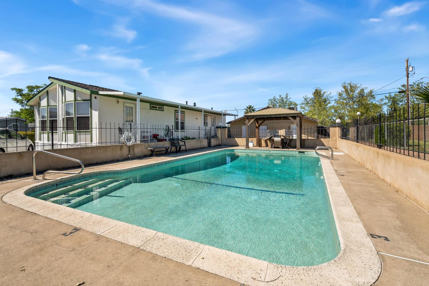 4695 Pacific Street, Unit 9 Rocklin, CA 95667 - Photo 18 of 27 a view of a house with a backyard porch and sitting area