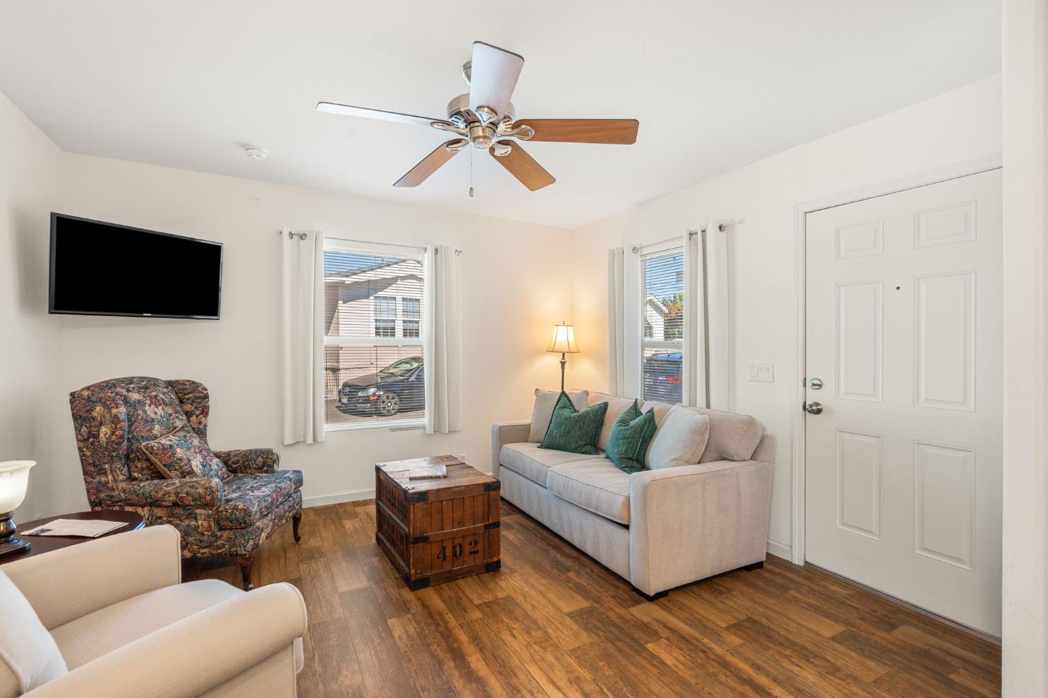 4695 Pacific Street, Unit 9 Rocklin, CA 95667 - Photo 2 of 27 a living room with furniture and a flat screen tv