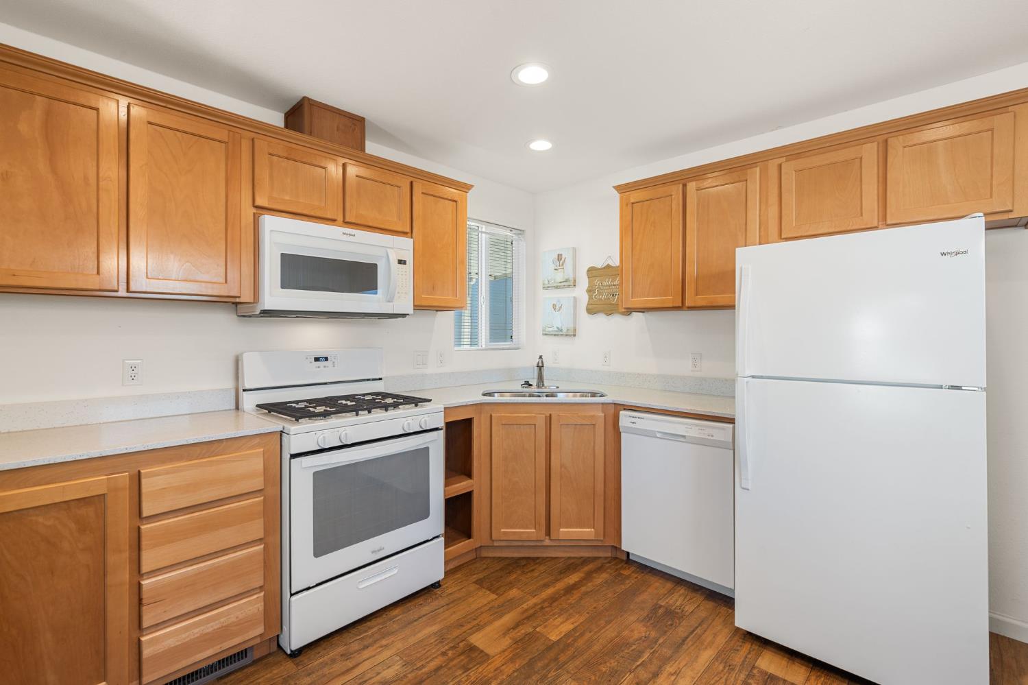 4695 Pacific Street, Unit 9 Rocklin, CA 95667 - Photo 7 of 27 a kitchen with a refrigerator sink and microwave