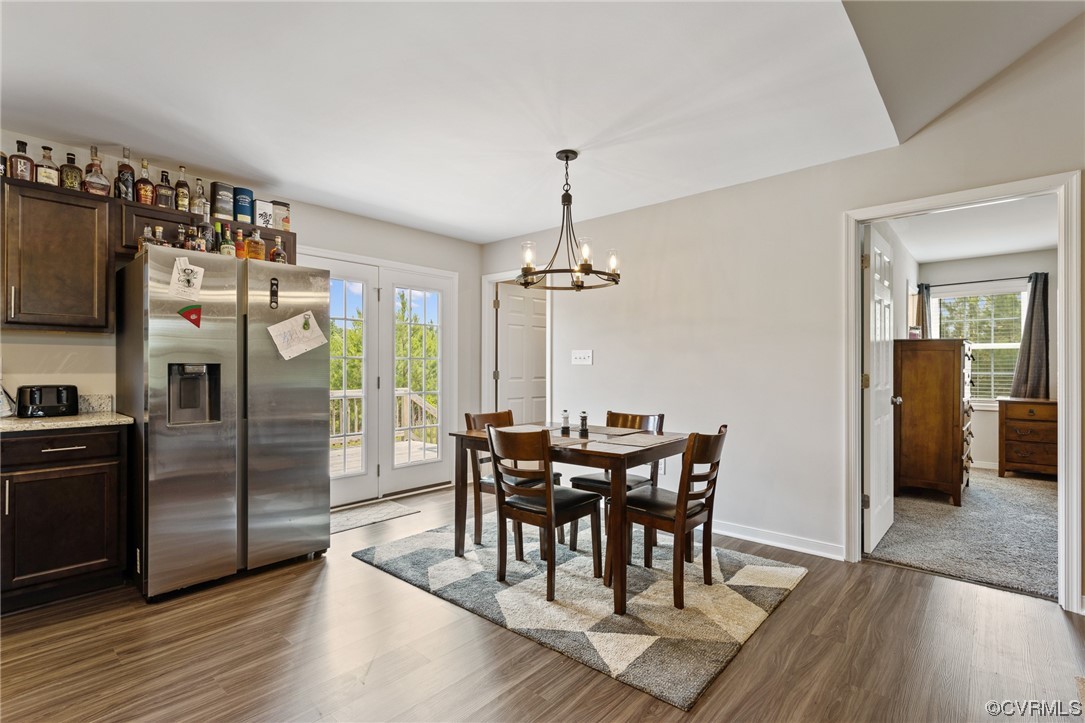 8073 Railroad Bed Road Carson, VA 23830 - Photo 9 of 25 a view of a dining room with furniture and wooden floor