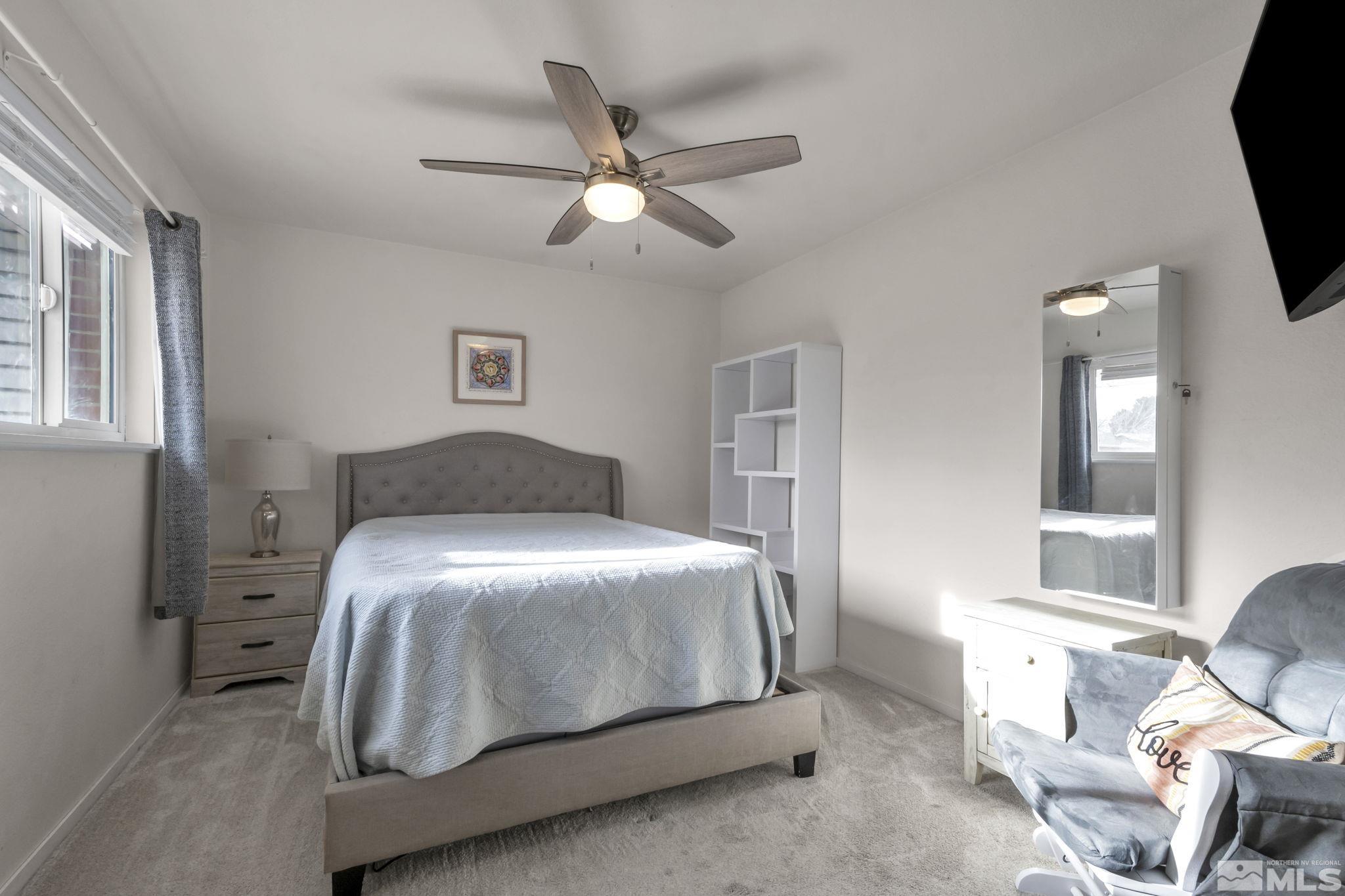 112 Smithridge Reno, NV 89502 - Photo 24 of 37 a bedroom with a bed and a window