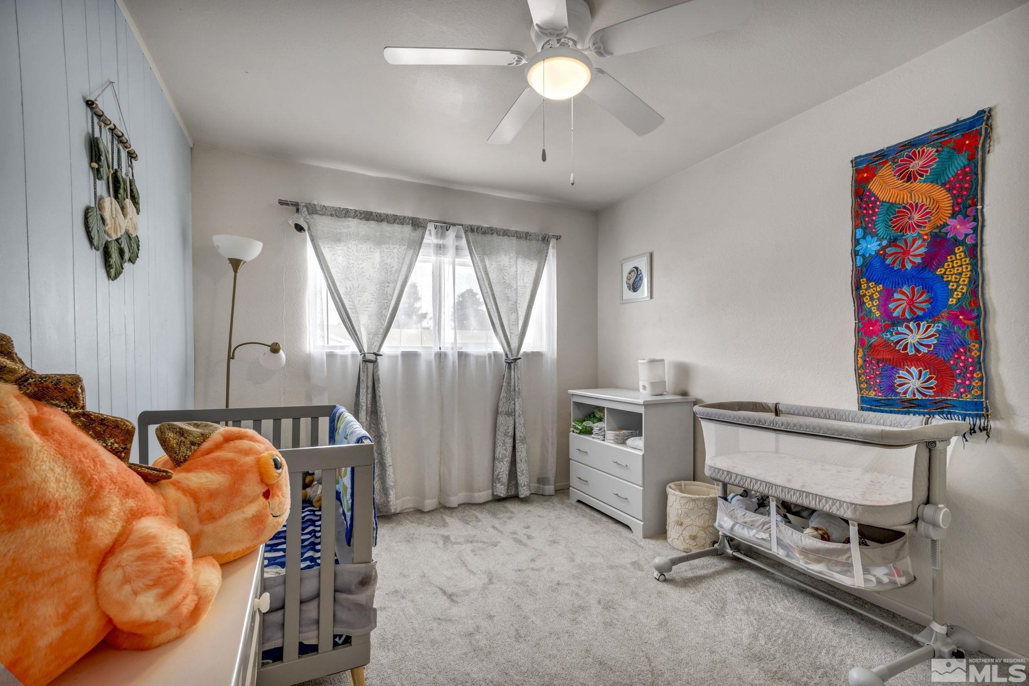 112 Smithridge Reno, NV 89502 - Photo 26 of 37 a bedroom with furniture and window