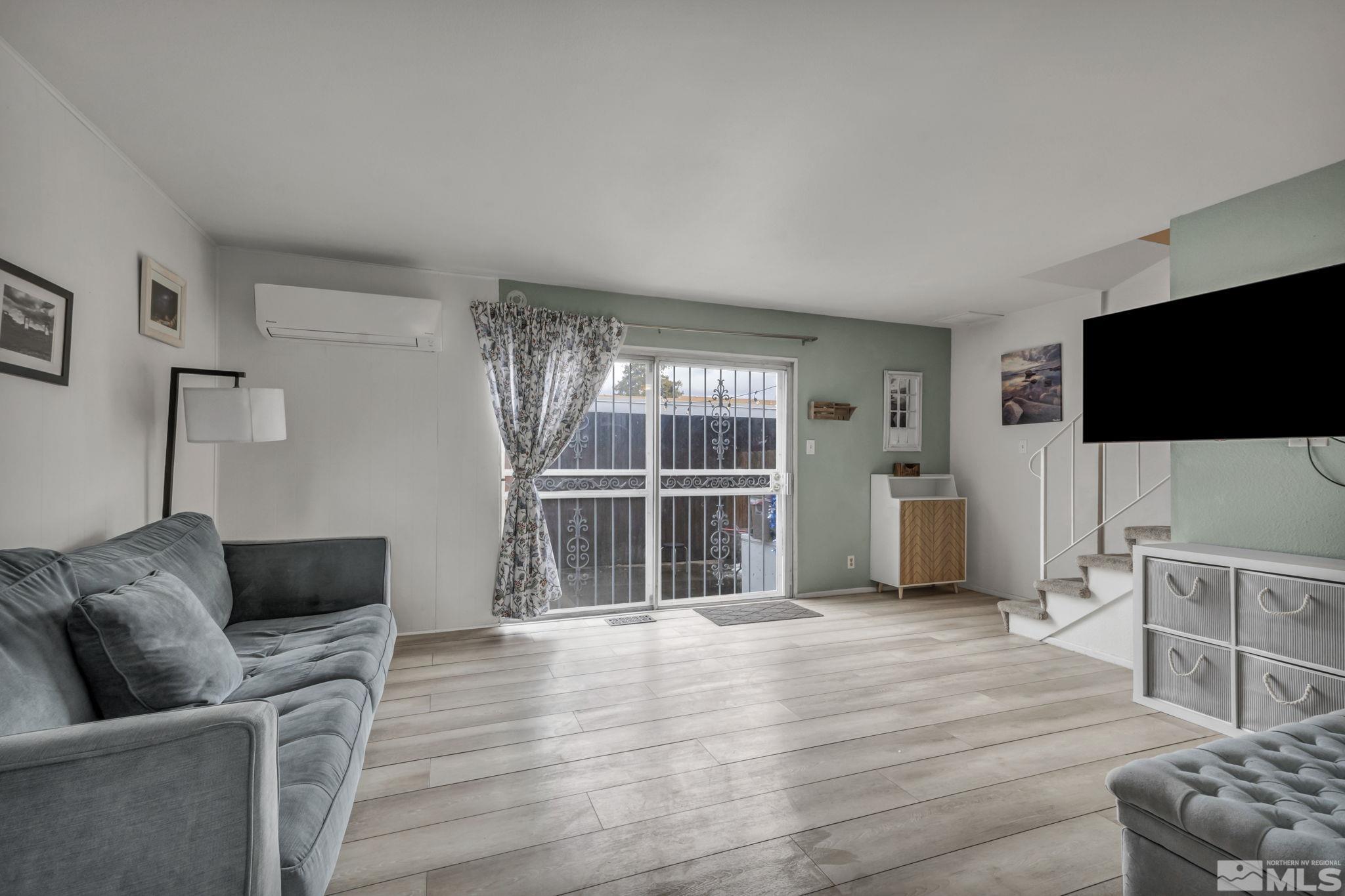 112 Smithridge Reno, NV 89502 - Photo 7 of 37 a living room with furniture and a flat screen tv