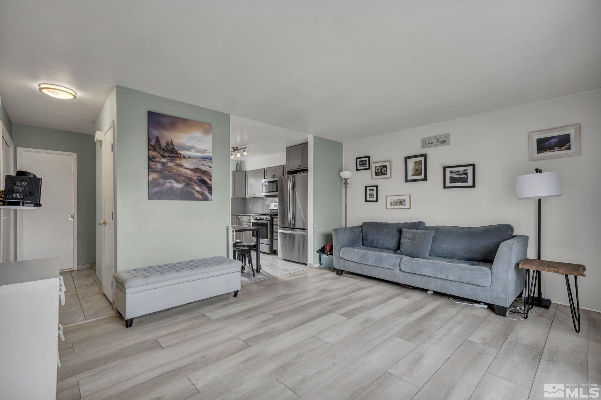 112 Smithridge Reno, NV 89502 - Photo 8 of 37 a living room with furniture and a wooden floor