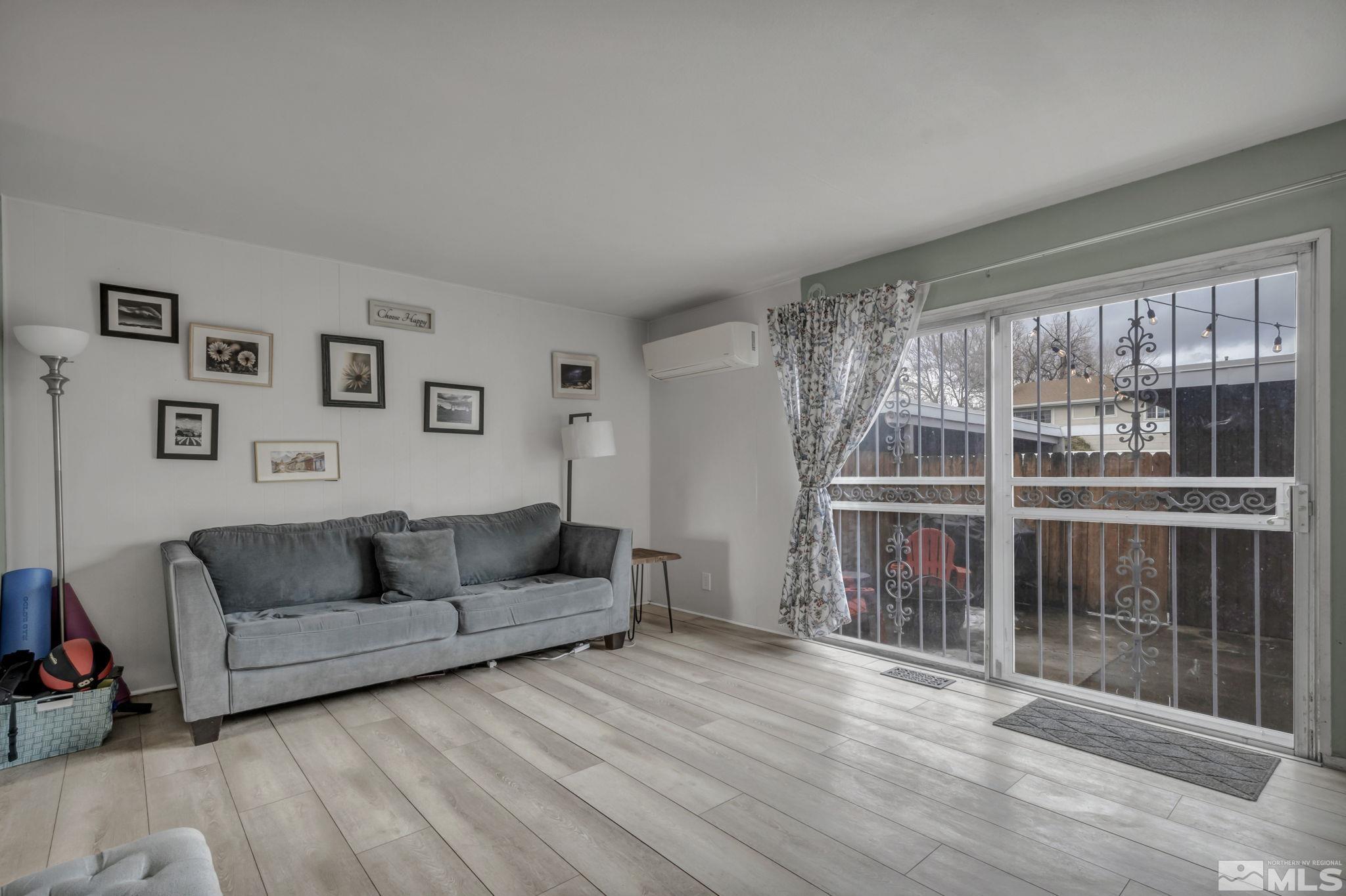 112 Smithridge Reno, NV 89502 - Photo 10 of 37 a living room with furniture and a large window
