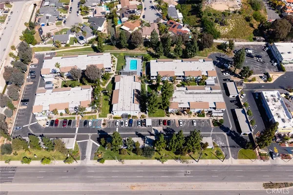 an aerial view of residential houses with city view