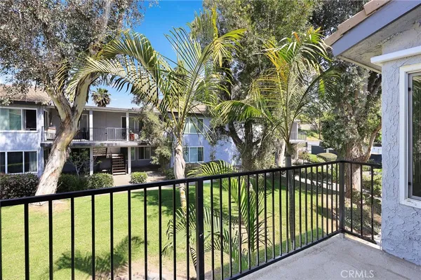 a view of a brick house with a large window