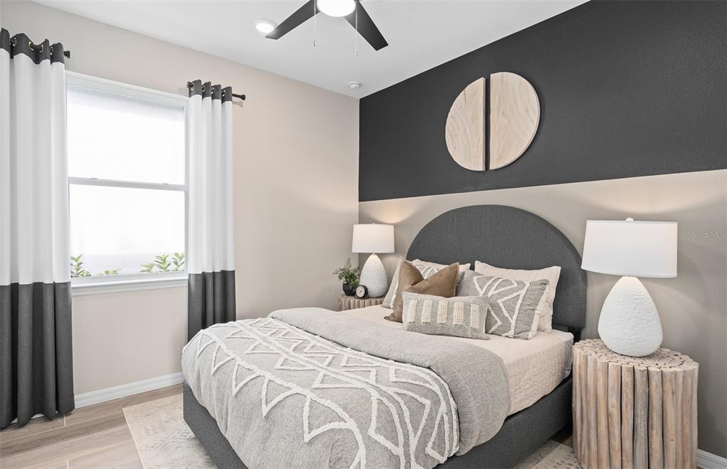 2370 Lily Bloom Road St. Cloud, FL 34771 - Photo 18 of 22 a bedroom with a bed and a window