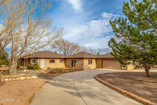 a view of a house with a snow in the yard