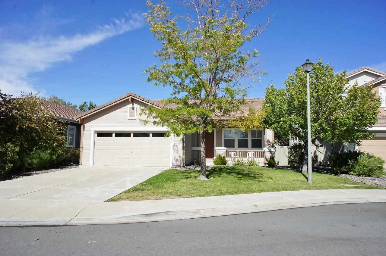 1681 Ashworth Court Reno, NV 89521 - Photo 1 of 1 a front view of a house with a yard and a garage