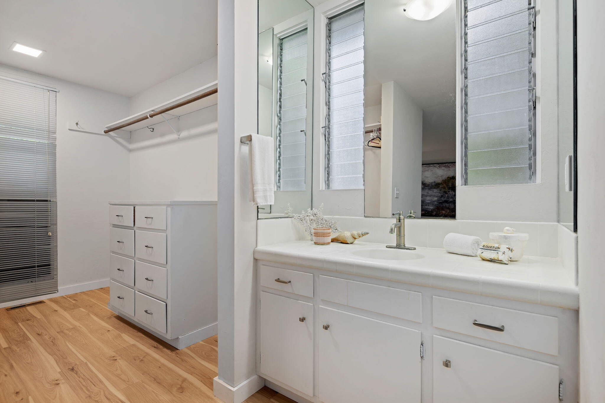 5 Fellowship Circle Santa Barbara, CA 93109 - Photo 13 of 32 a bathroom with a double vanity sink and mirror