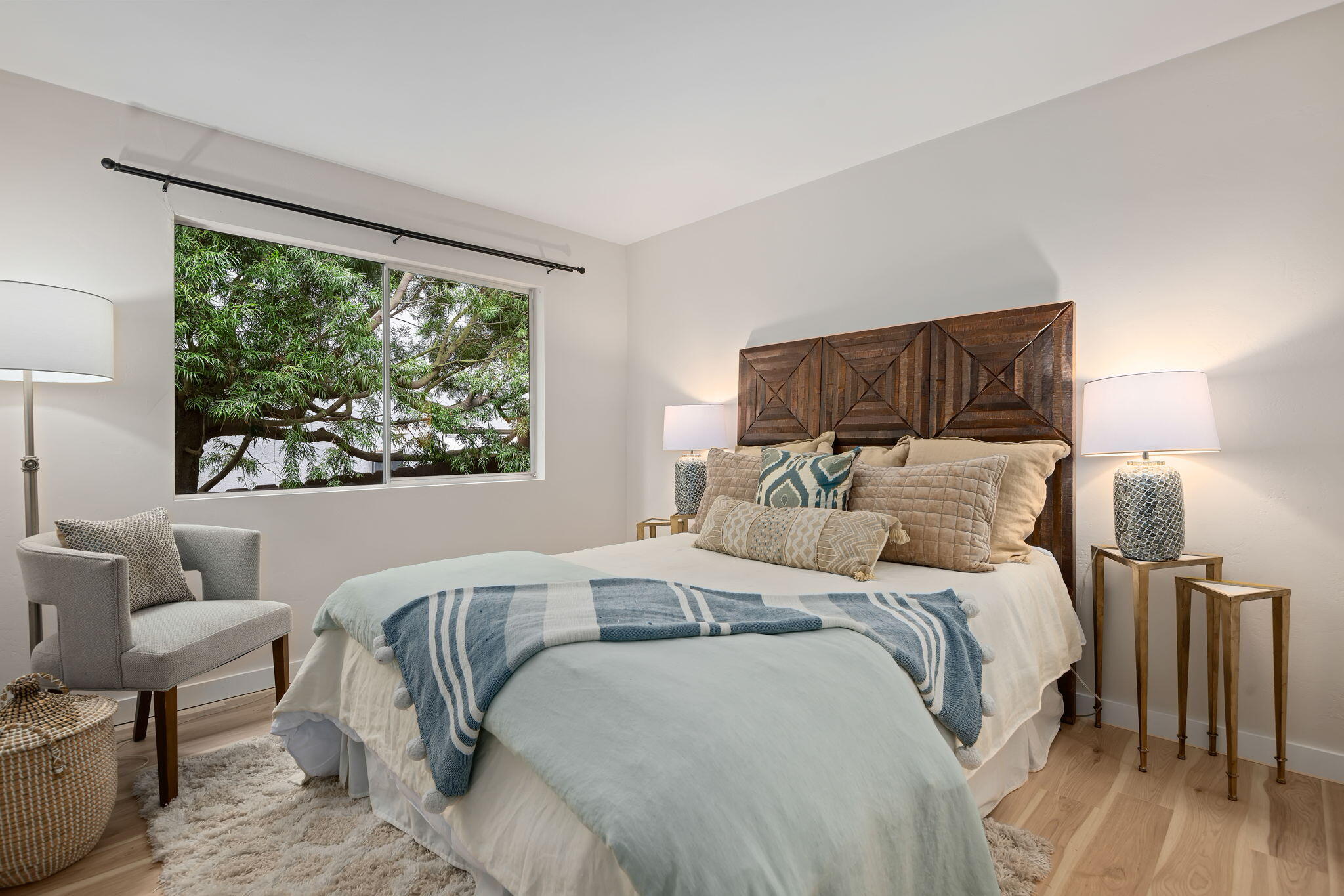 5 Fellowship Circle Santa Barbara, CA 93109 - Photo 16 of 32 a bedroom with a bed and wooden floor