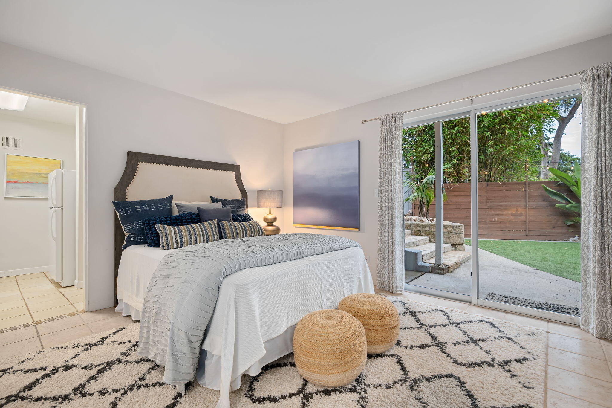 5 Fellowship Circle Santa Barbara, CA 93109 - Photo 18 of 32 a bedroom with a bed and glass door