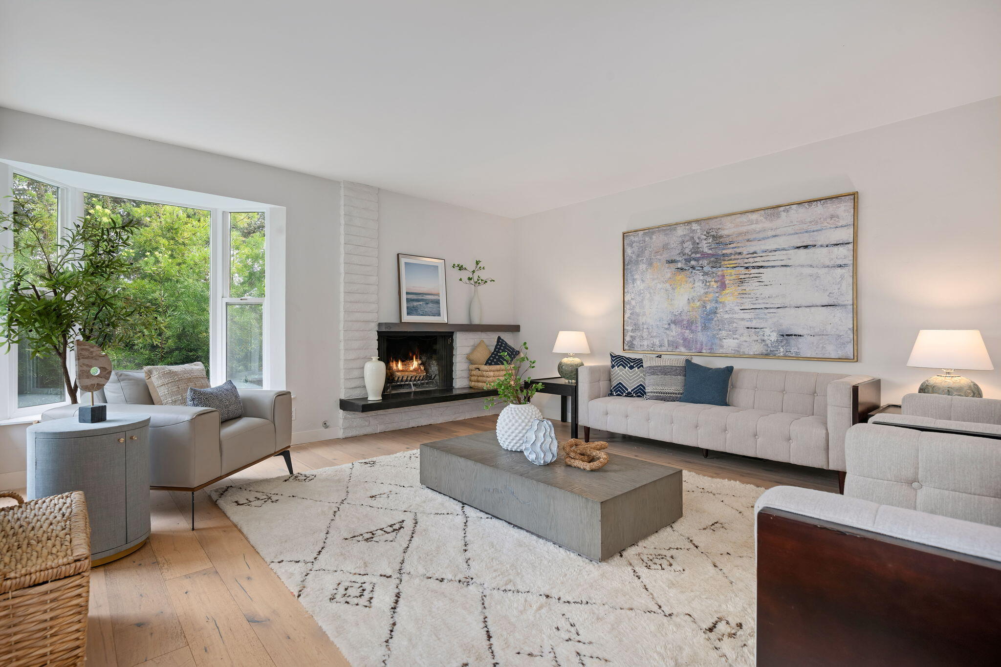 5 Fellowship Circle Santa Barbara, CA 93109 - Photo 3 of 32 a living room with furniture a large window and a fireplace