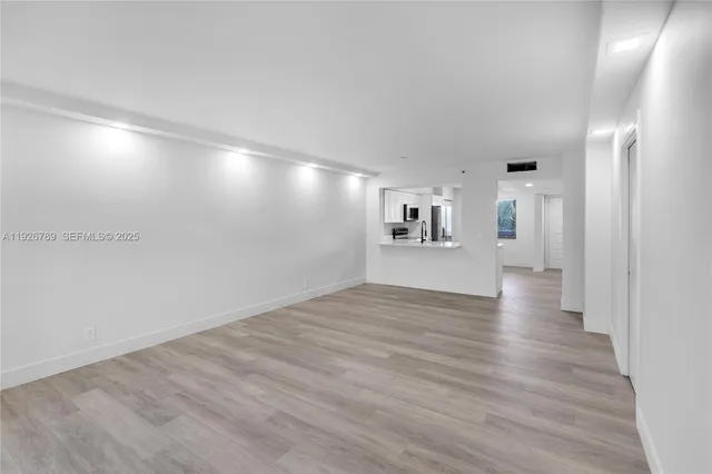 a view of a livingroom with wooden floor