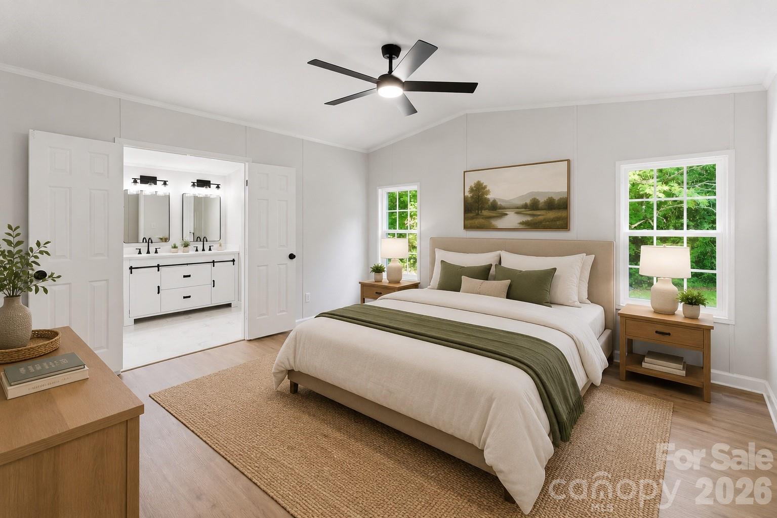 481 Harrell Road Burgaw, NC 28425 - Photo 9 of 25 a bedroom with a large bed and a chandelier