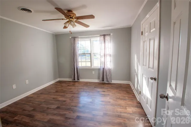 a view of an empty room with stairs