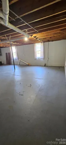 a view of balcony with floor to ceiling windows and yard