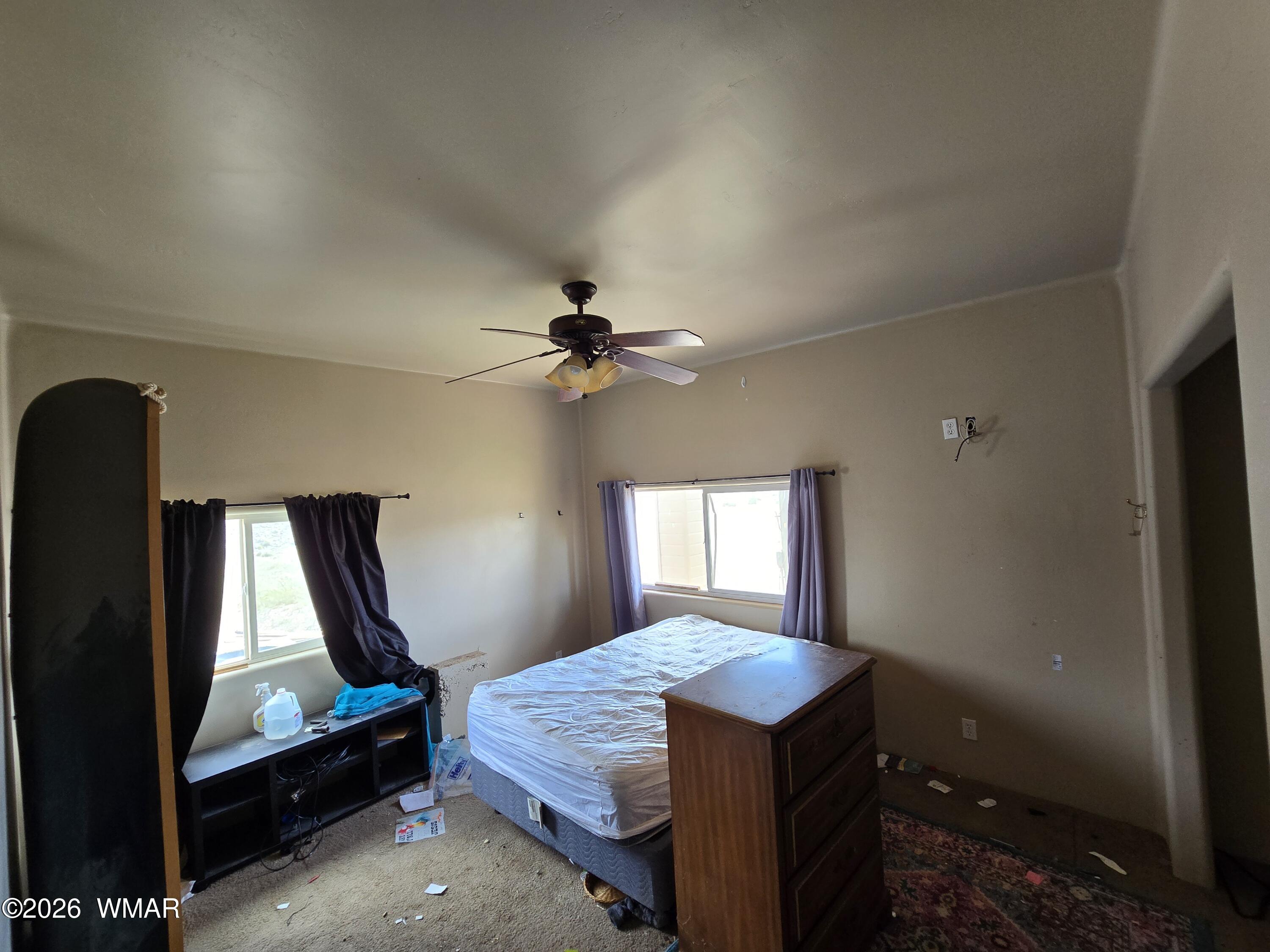 9046 Miller Trail Snowflake, AZ 85937 - Photo 25 of 34 a bedroom with a bed and a mirror