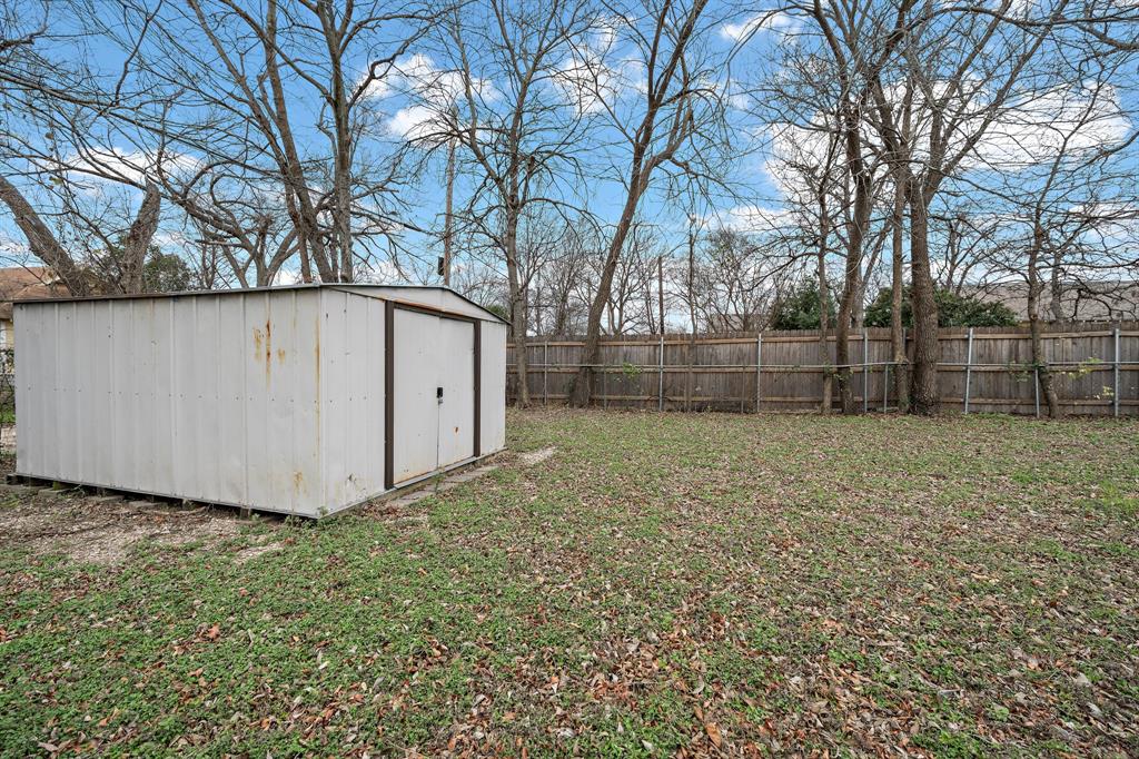 1916 Mitchell Avenue Waco, TX 76708 - Photo 13 of 32 a backyard of a house with a trees