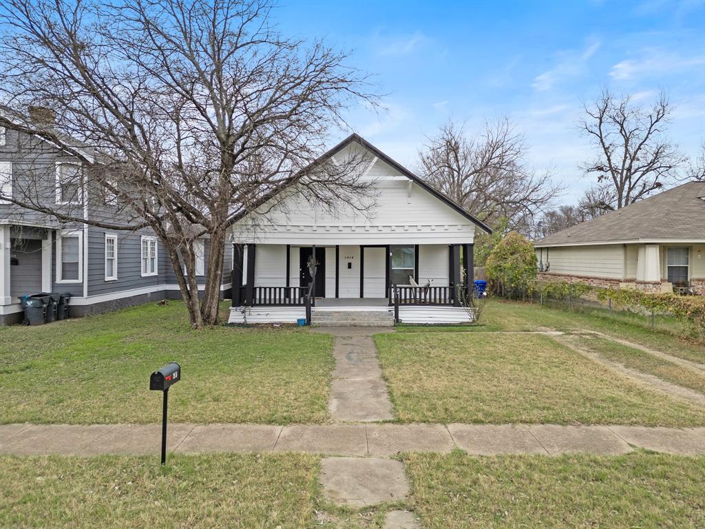 1916 Mitchell Avenue Waco, TX 76708 - Photo 2 of 32 a front view of a house with a garden