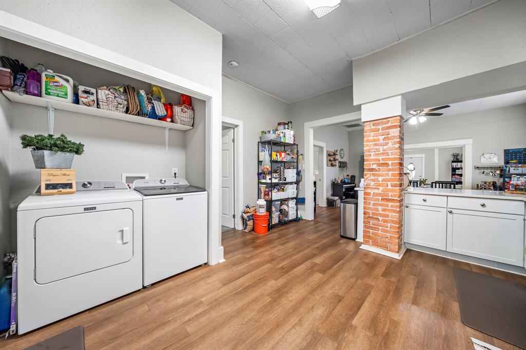 1916 Mitchell Avenue Waco, TX 76708 - Photo 23 of 32 a view of a kitchen with fridge and wooden floor
