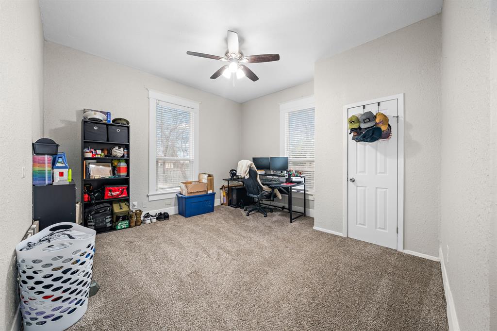 1916 Mitchell Avenue Waco, TX 76708 - Photo 24 of 32 a living room with furniture and a gym equipment