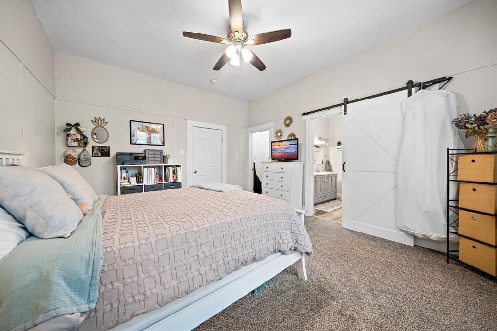 1916 Mitchell Avenue Waco, TX 76708 - Photo 27 of 32 a bedroom with a bed and a walk in closet