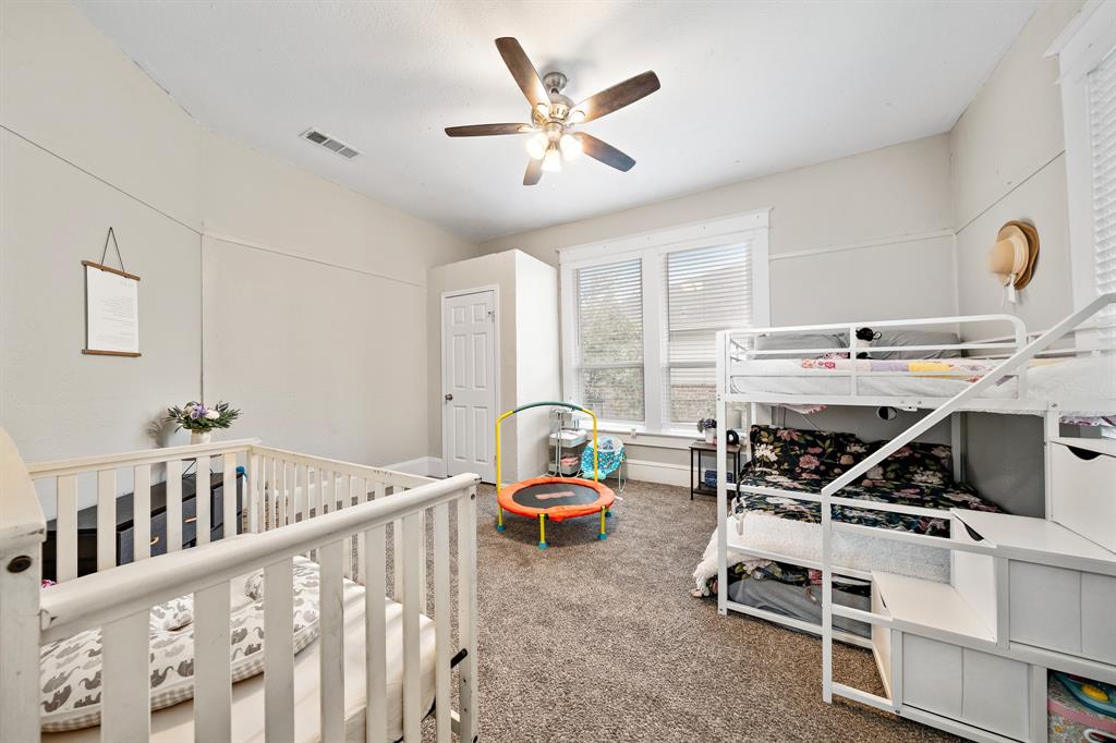 1916 Mitchell Avenue Waco, TX 76708 - Photo 29 of 32 a living room with furniture and white walls
