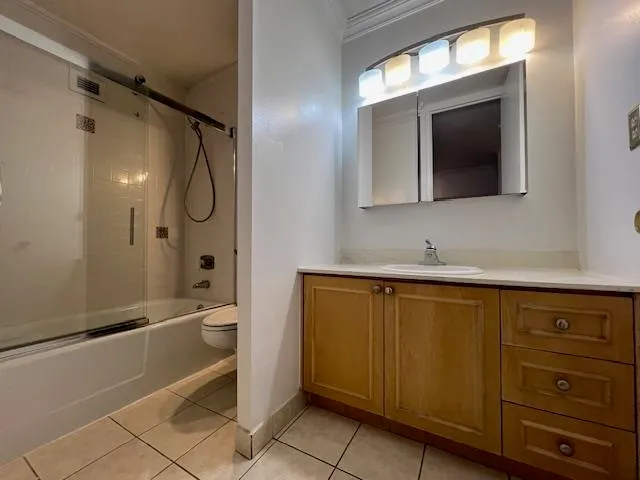 a bathroom with a toilet sink and shower
