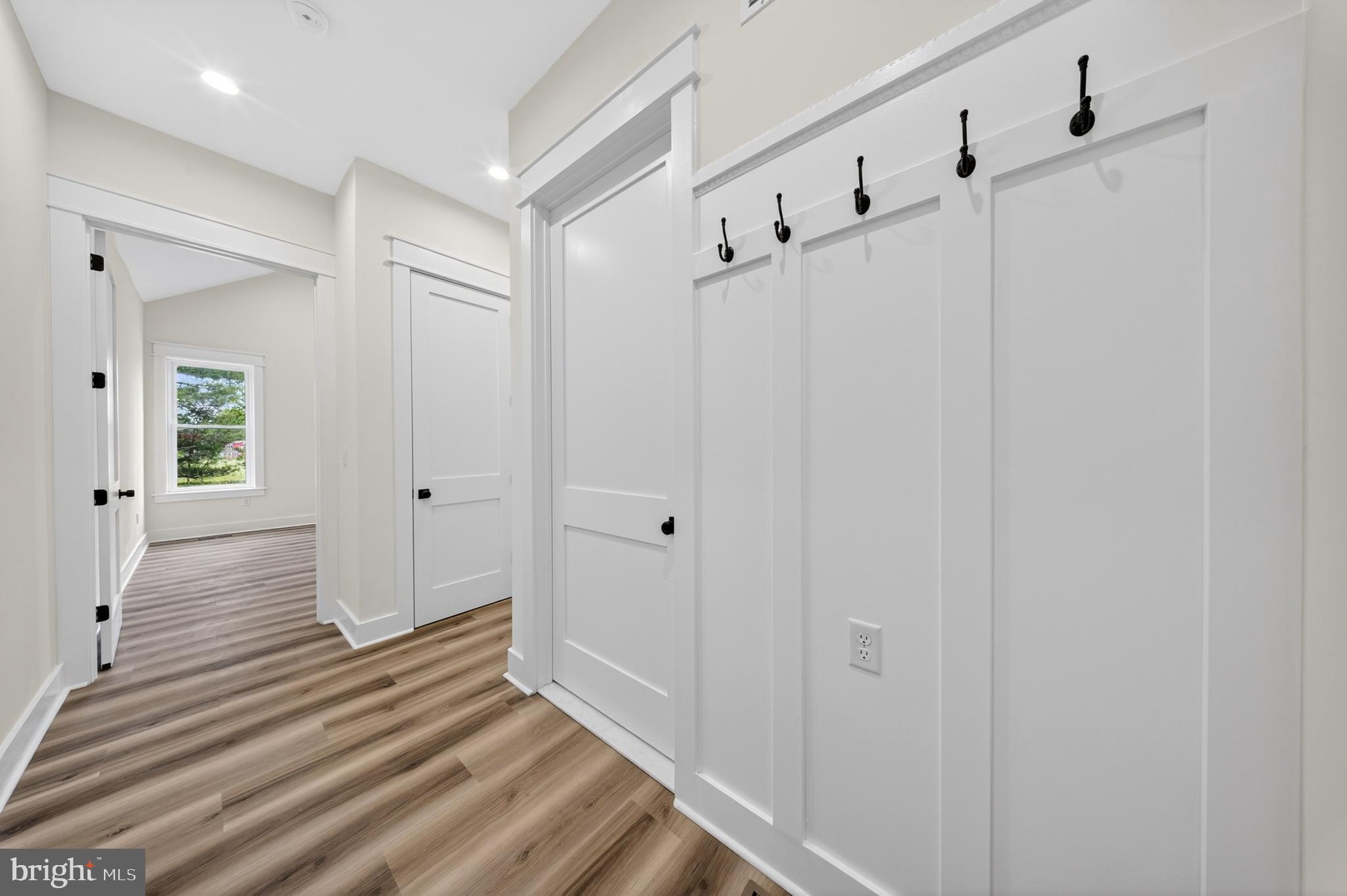 14133 Pepperbox Road Delmar, DE 19940 - Photo 23 of 59 a view of a hallway with wooden floor and staircase