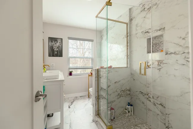 a bathroom with a bathtub and shower