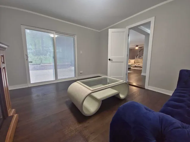 a bathroom with a tub a sink and a large mirror