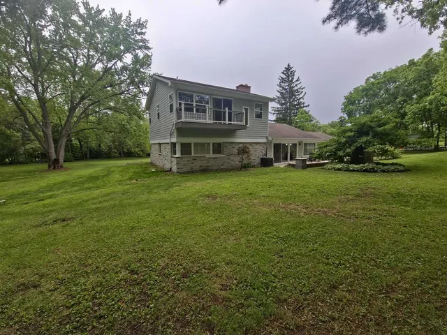a view of backyard with a garden and entertaining space