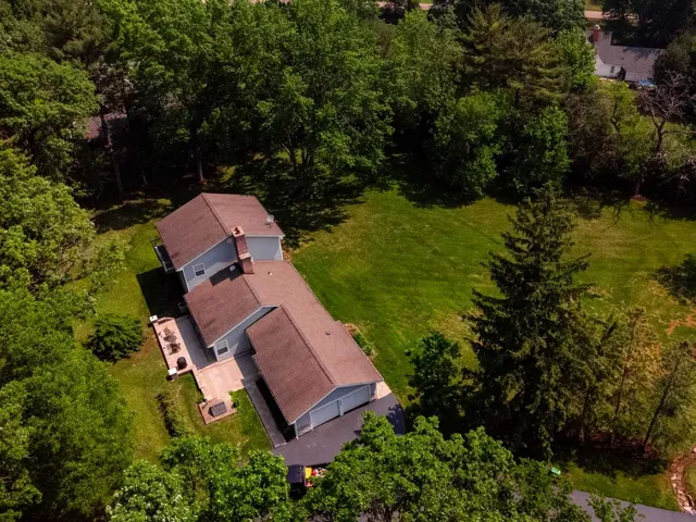 an aerial view of a house with a garden