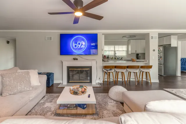a living room with furniture and a fireplace