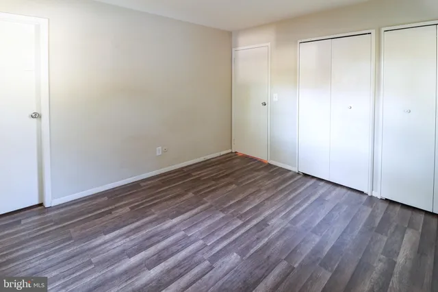 a view of room with wooden floor