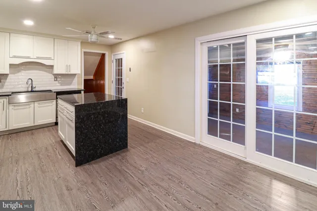 a kitchen with wooden cabinets and a sink