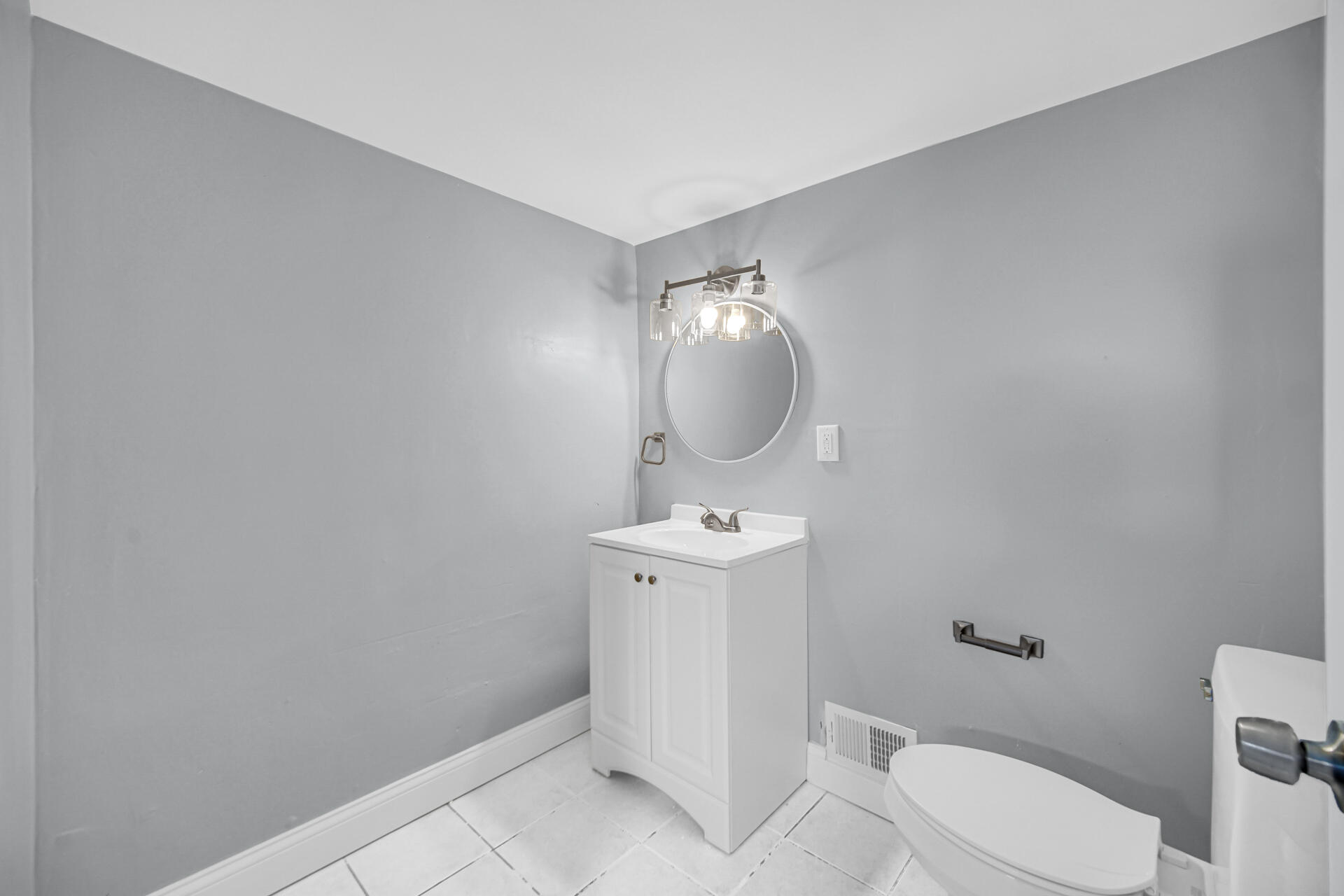 699 State Street Gary, IN 46403 - Photo 18 of 24 a bathroom with a toilet sink and mirror