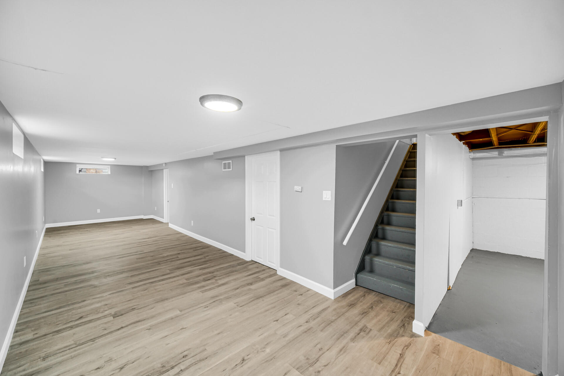 699 State Street Gary, IN 46403 - Photo 20 of 24 a view of an empty room with wooden floor and stairs