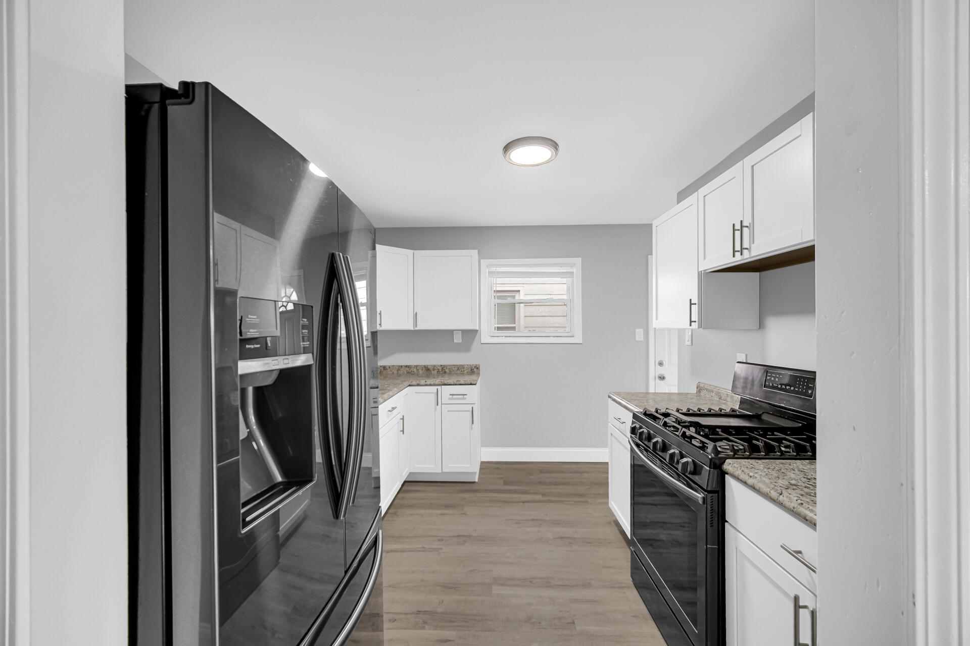 699 State Street Gary, IN 46403 - Photo 10 of 24 a kitchen with stainless steel appliances granite countertop a refrigerator stove and sink